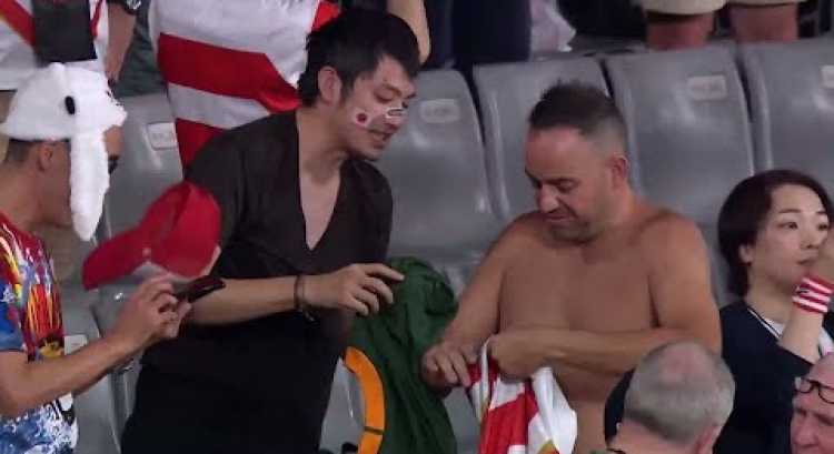 Fans swap shirts in stands